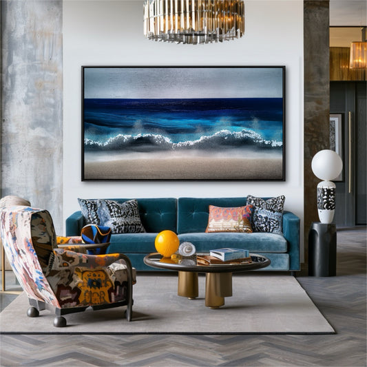 A large ocean painting hangs in a bold, eclectic living room with a teal sofa, patterned chair, and concrete wall.