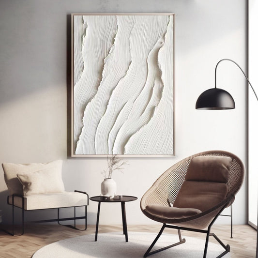 Original relief art above a cozy reading nook with a rattan cane chair and a minimalist black accent lamp.