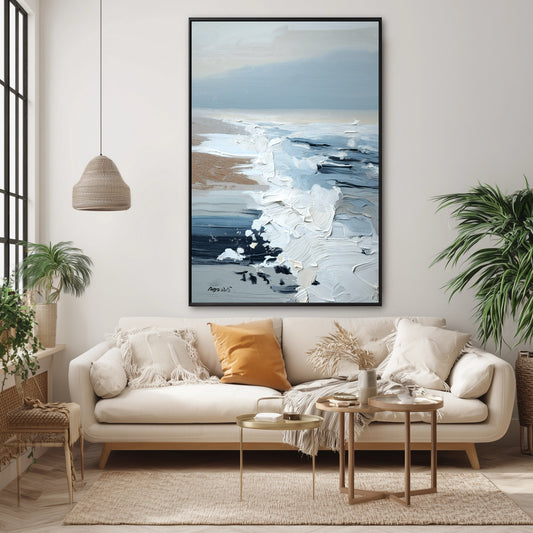 The vertical painting's cool blue impasto provides a striking, textural contrast to the warm orange pillow on the boho-style sofa.