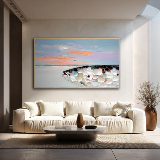A large, textured fish painting hangs in a bright, minimalist living room above a plush, cream-colored sofa.