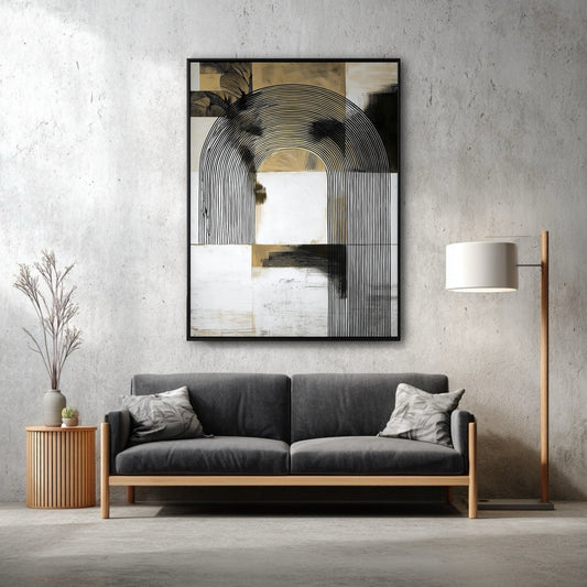 A vertical abstract arch painting hangs on a concrete wall above a modern dark grey sofa, adding sophistication to the industrial-style room.