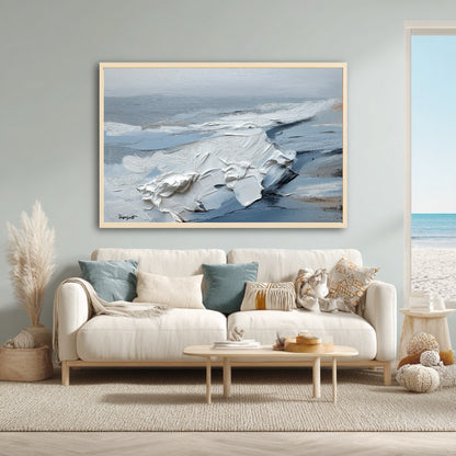 The abstract seascape painting's blue and white tones perfectly complement a beach house living room with coastal and boho decor.