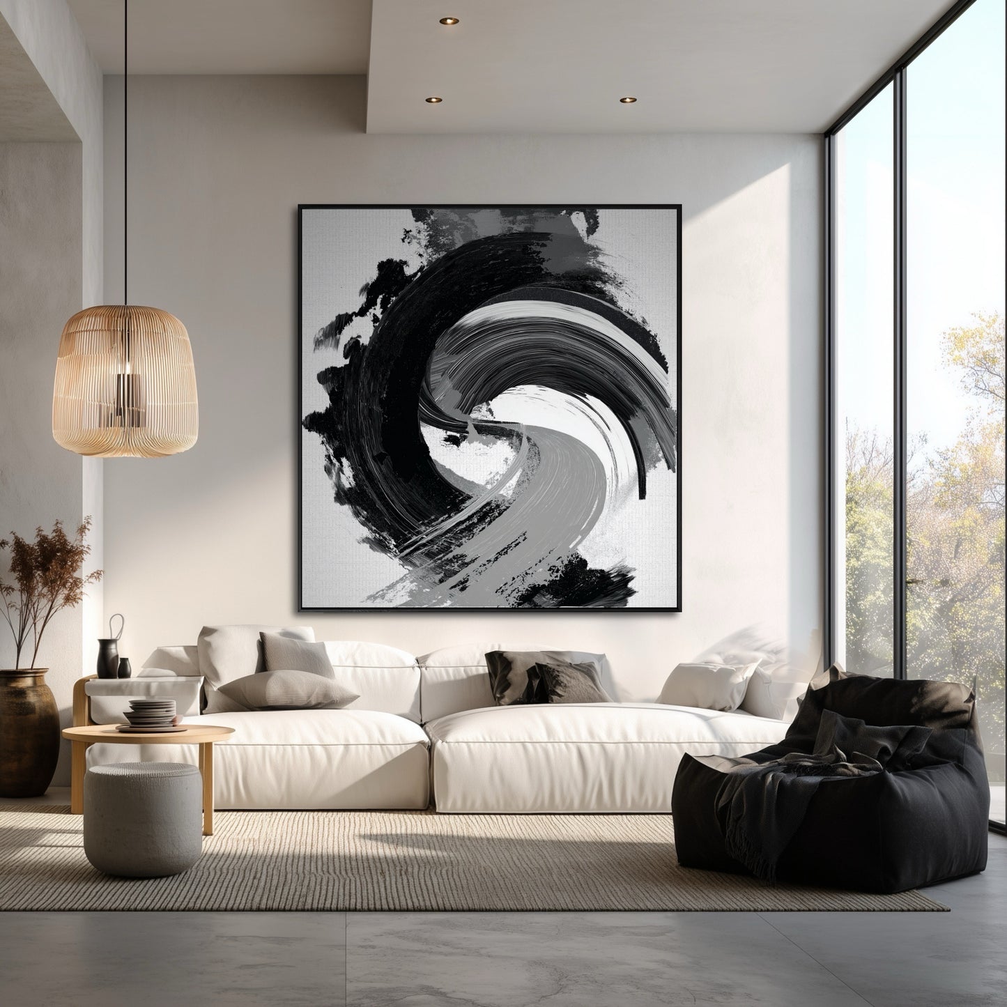 Vertical abstract yin-yang painting in a large, minimalist living room with high ceilings and a white sectional sofa.