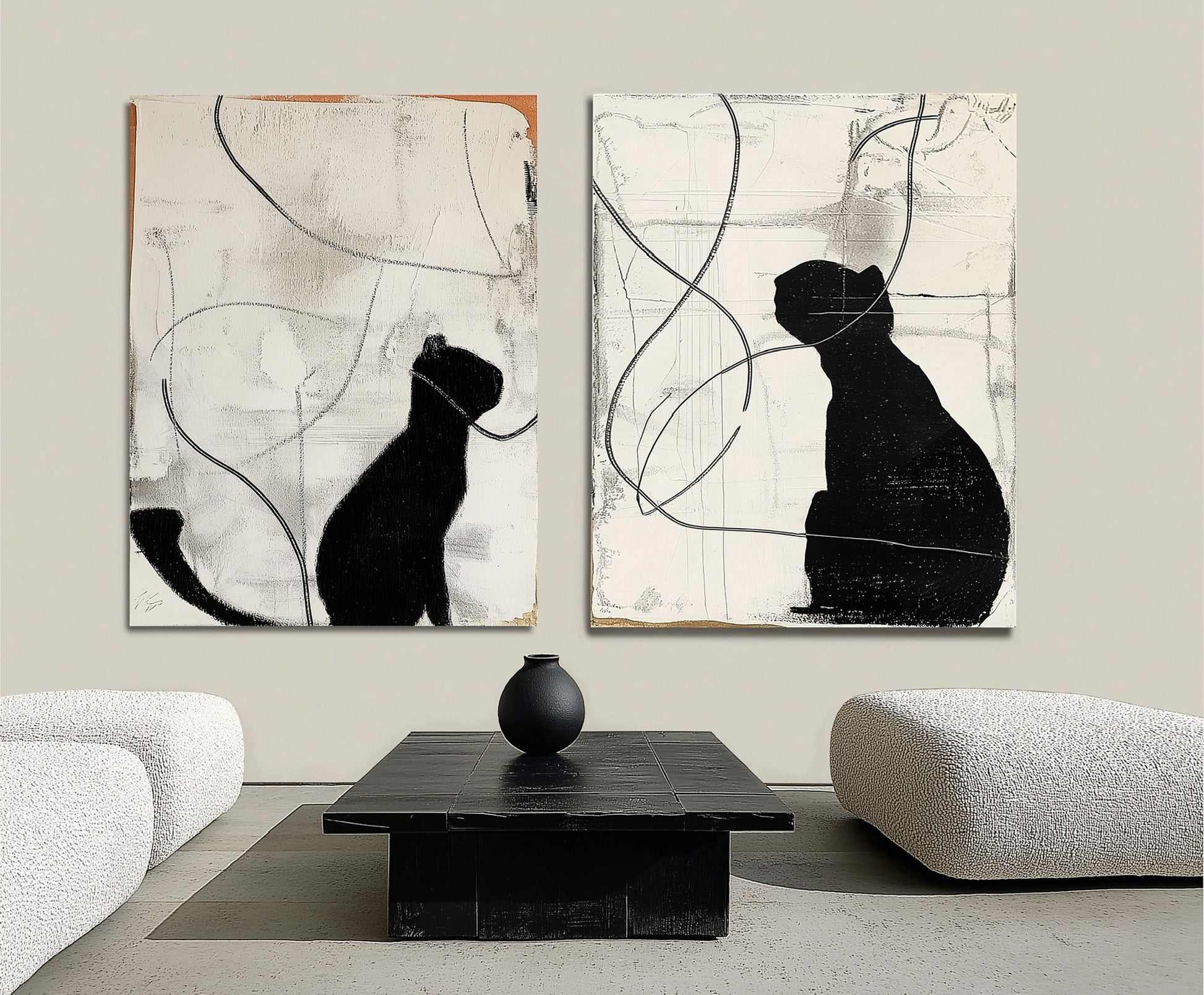 Original black cat diptych creates a bold, minimalist focal point over a dark rectangular table in a sleek, white lounge area.