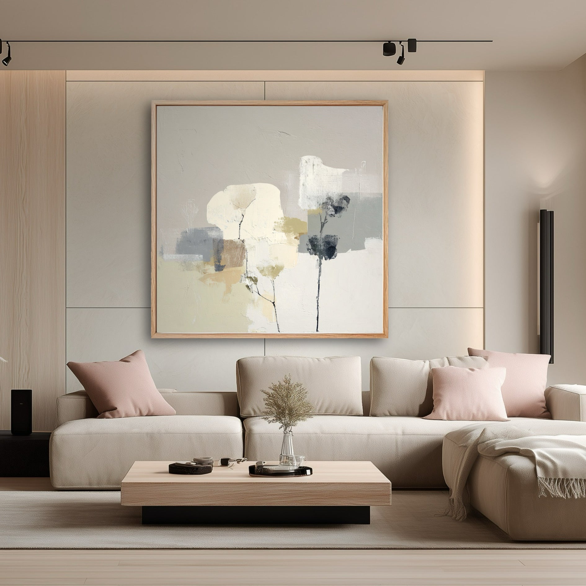 A large abstract painting complements a modern minimalist living room, its neutral colors tying in the beige sofa and light wood accents.