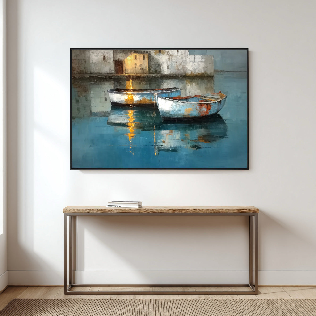 Horizontal two boats painting hangs over a sleek wood and metal console table in a bright, minimalist entryway.