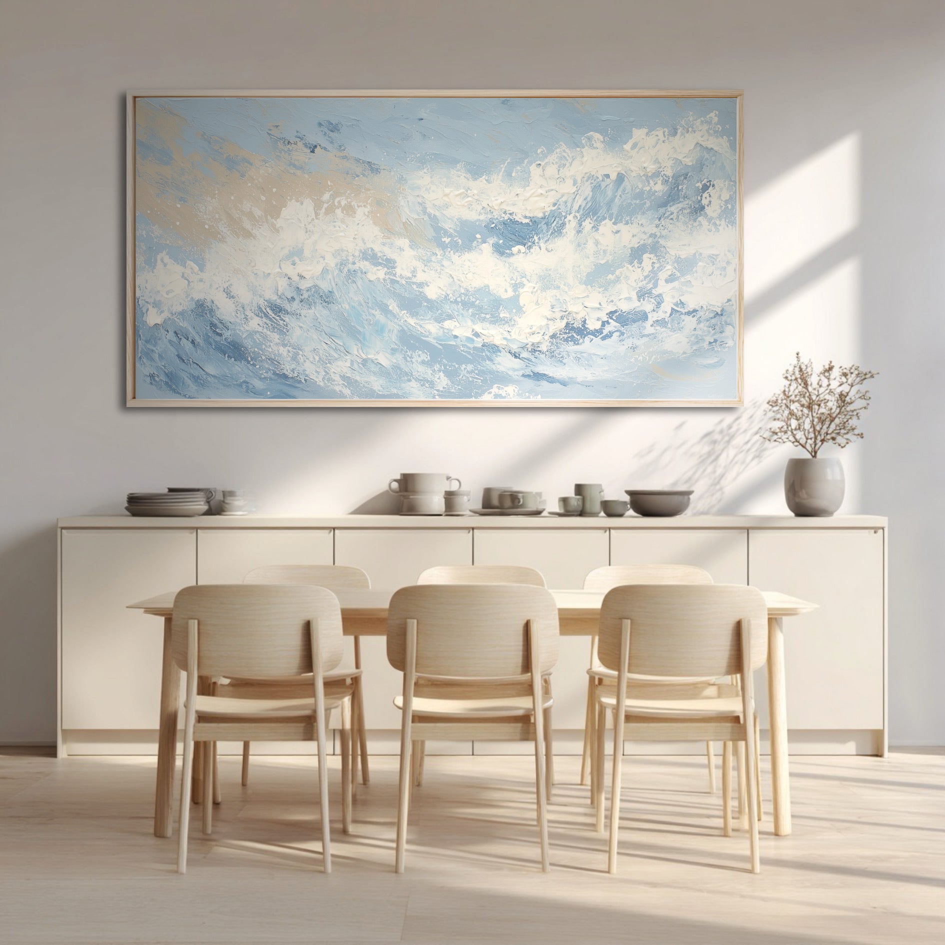 The abstract ocean painting adds soft, cool color and texture, warming the clean lines of a minimalist, light-wood dining room.