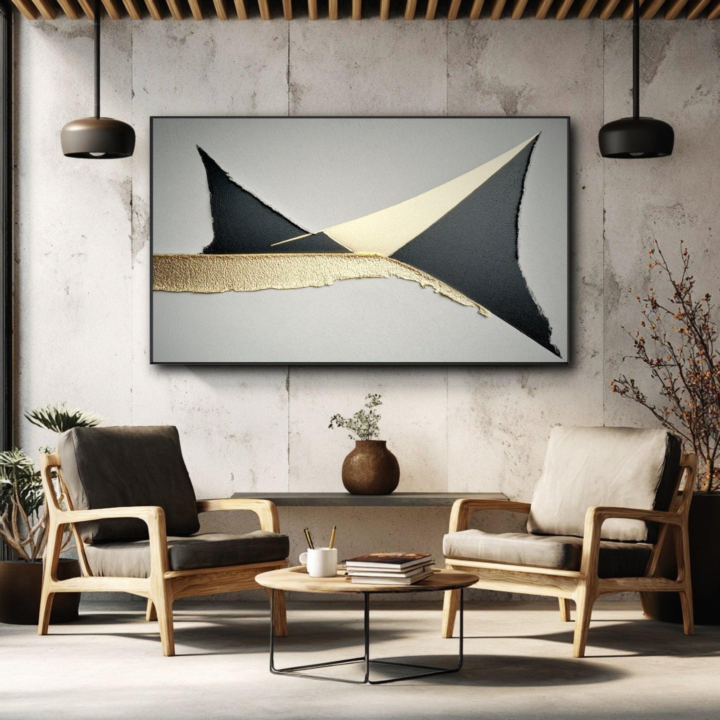 Horizontal black and gold leaf painting on a concrete wall above two modern armchairs in an industrial-style room.