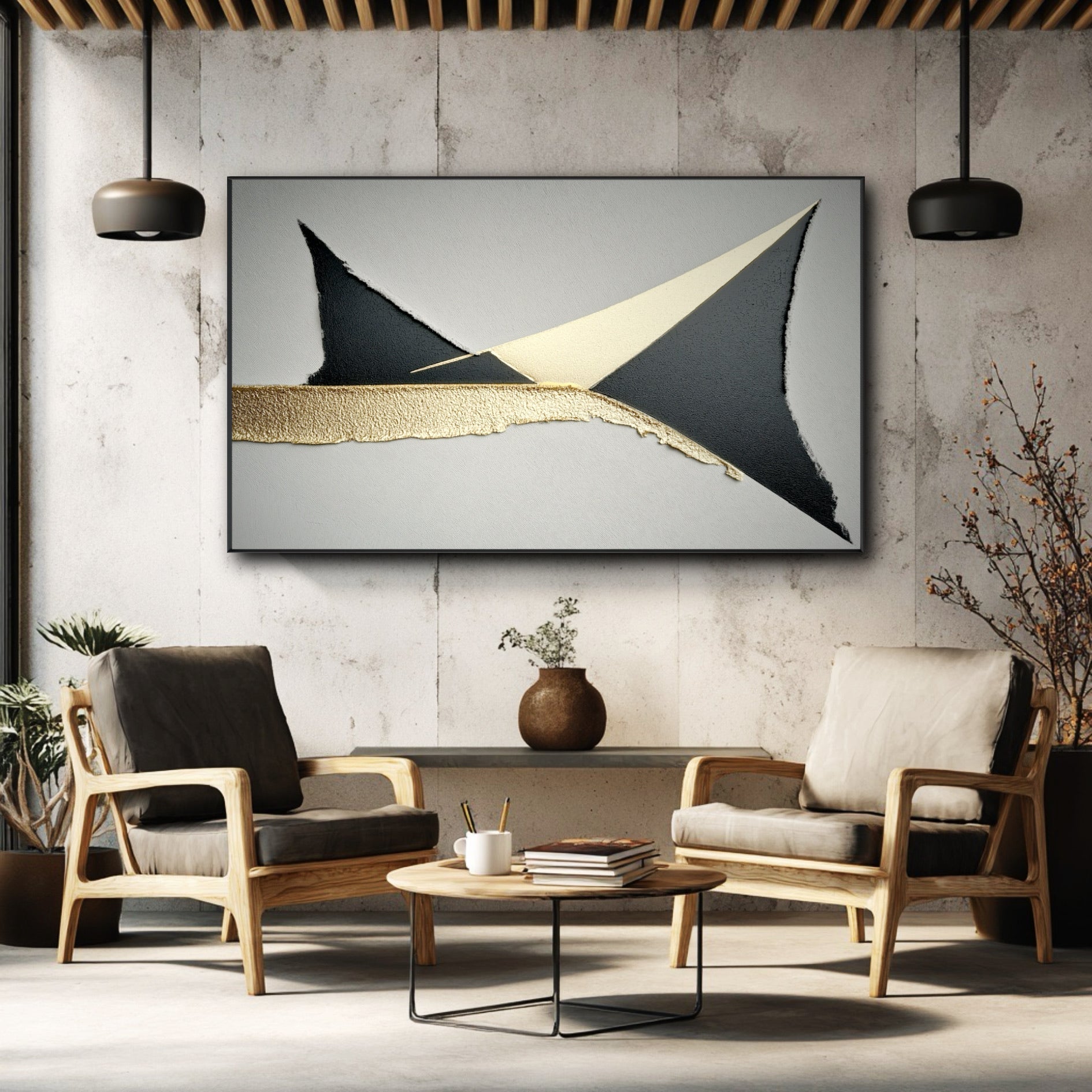 Horizontal black and gold leaf painting on a concrete wall above two modern armchairs in an industrial-style room.