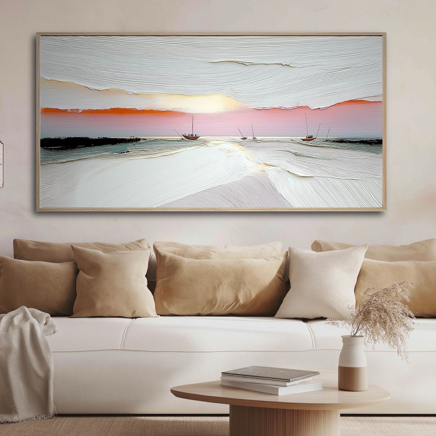 A large, textured seascape painting hangs above a plush beige sofa, adding a serene, artistic focal point to the cozy living room.