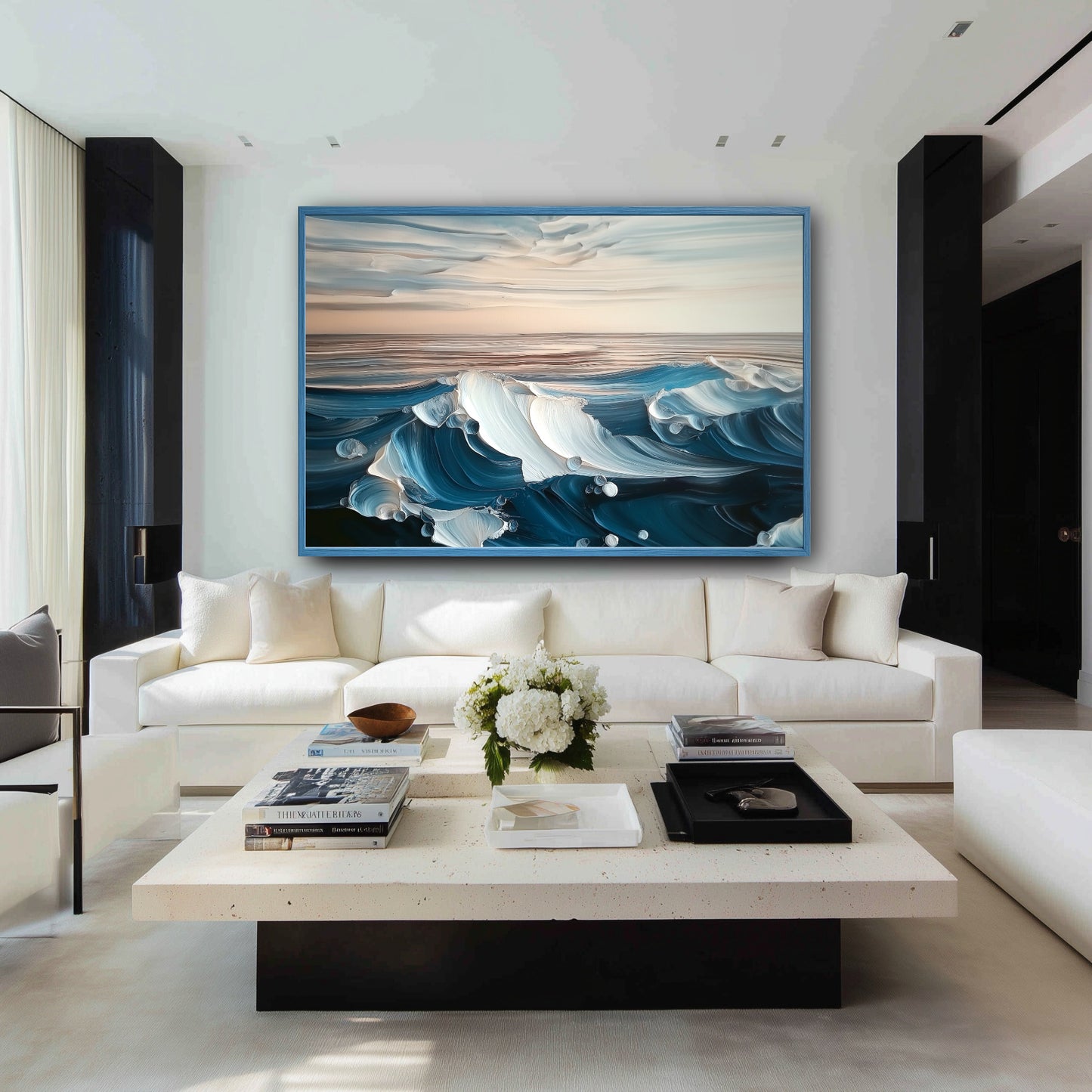 A large, textured blue wave painting hangs above a white sofa in a modern black and white living room.