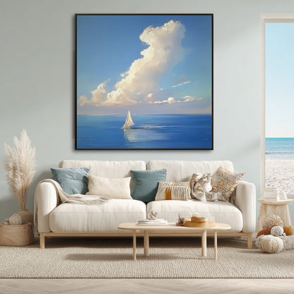 Airy coastal living room featuring a large seascape painting above a white sofa, with a window view of the beach.