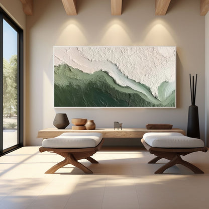 Textured abstract art enhances a zen, minimalist space with a low wood table and la arge vertical window.