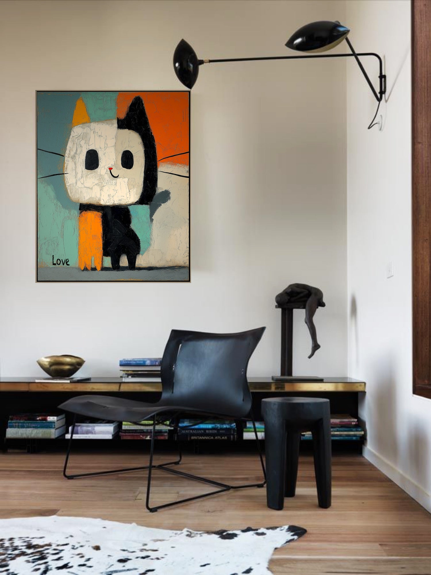 Original abstract cat art provides a vivid, high-contrast accent above a sleek black leather chair in a contemporary reading nook.