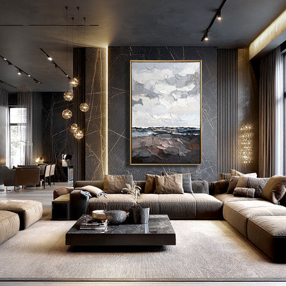 Original impasto art contrasting a dark, moody living space with a velvet sectional and warm accent lighting.