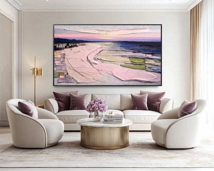 Original impasto beach art creating a stunning focal point above a luxurious cream sofa with plush velvet purple accents in an elegant, modern space.