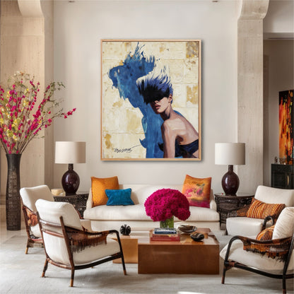 Large portrait painting with a blue shadow hanging above a white sofa in a colorful, eclectic living room.