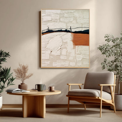 Textured abstract landscape adds striking depth and visual interest above the modern wood-frame chair in this bright reading nook.