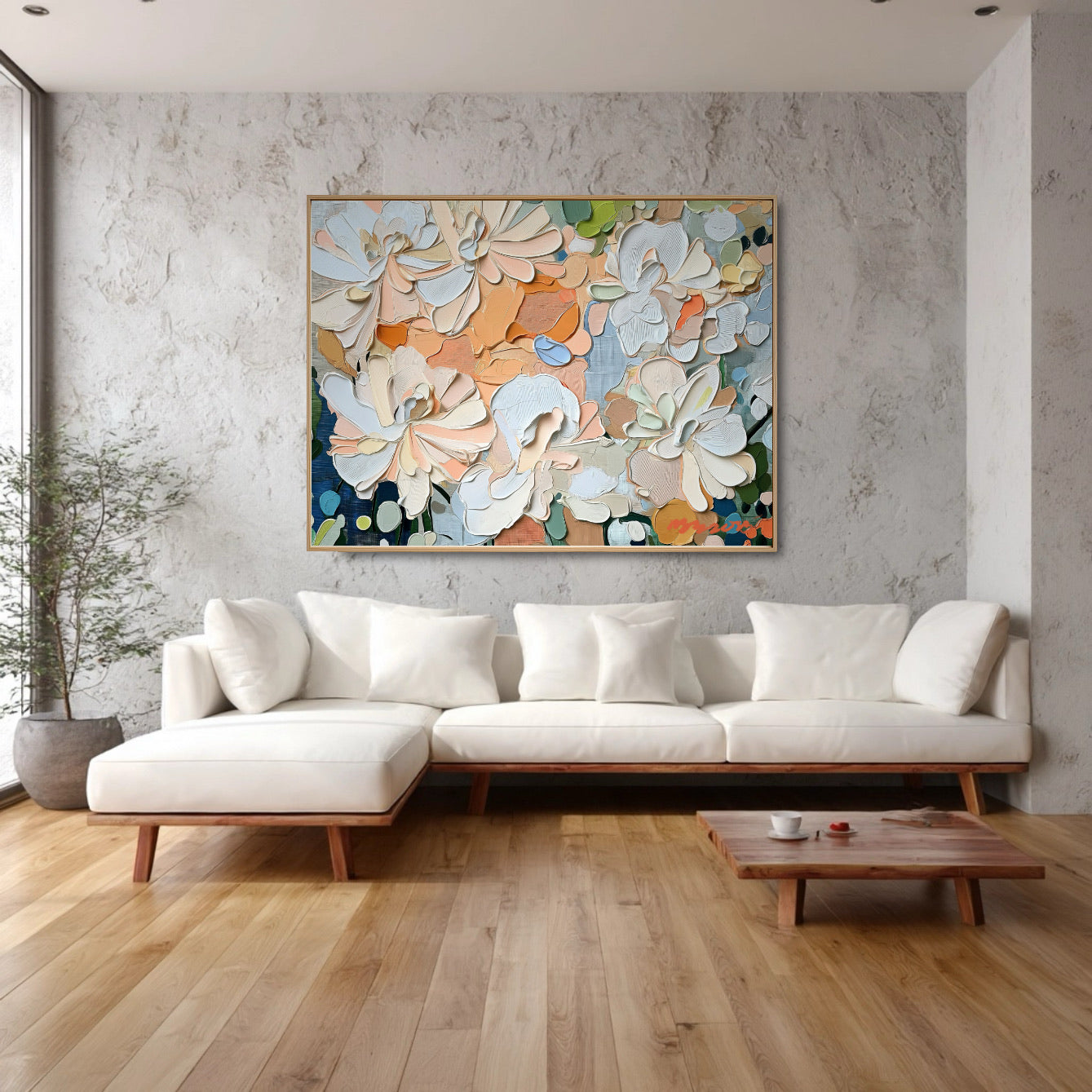 Textured floral abstract softens the rough concrete-like wall, unifying the natural wood floor and modern white sectional sofa.