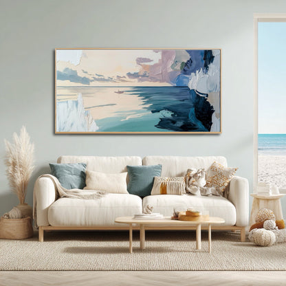 Airy coastal living room with a white sofa and beach view, featuring a large abstract ocean painting on a light blue wall.