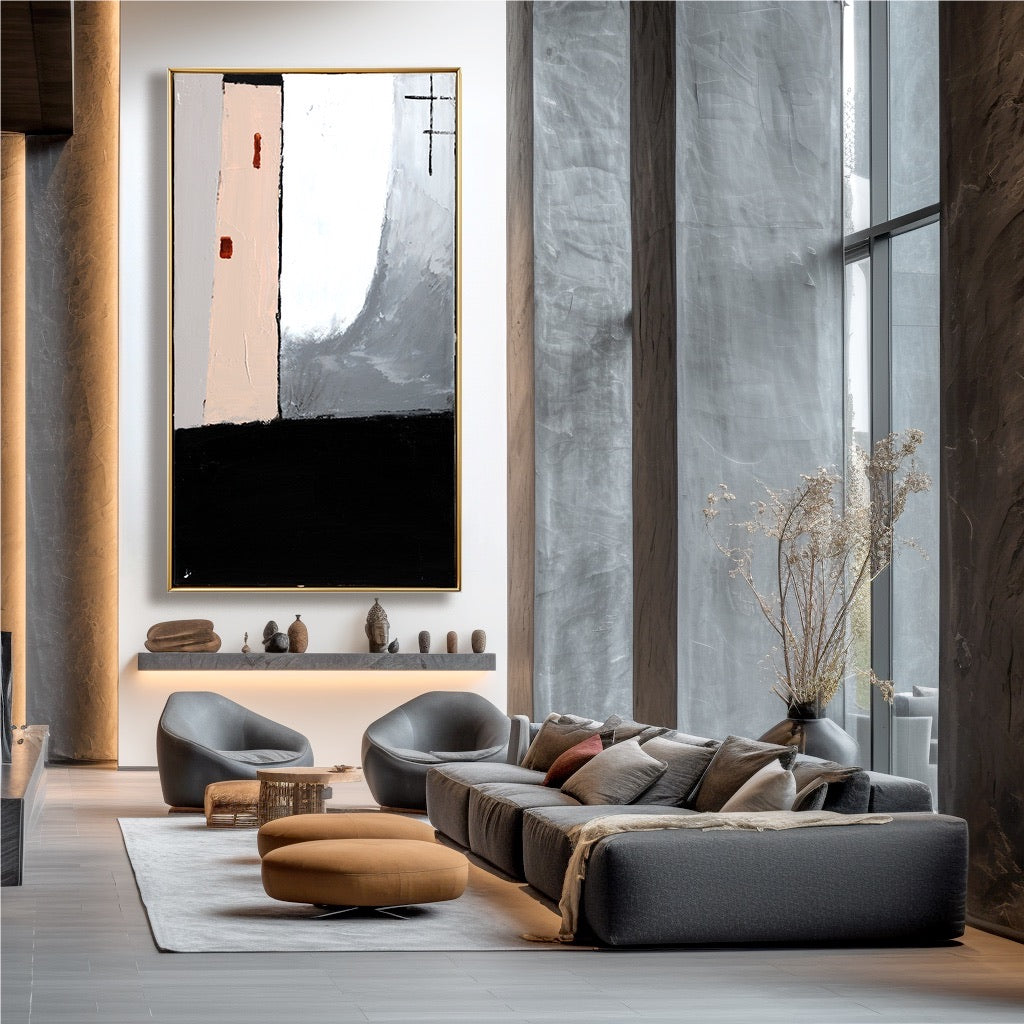 Modern living room with gray sofa, abstract art, and large windows.