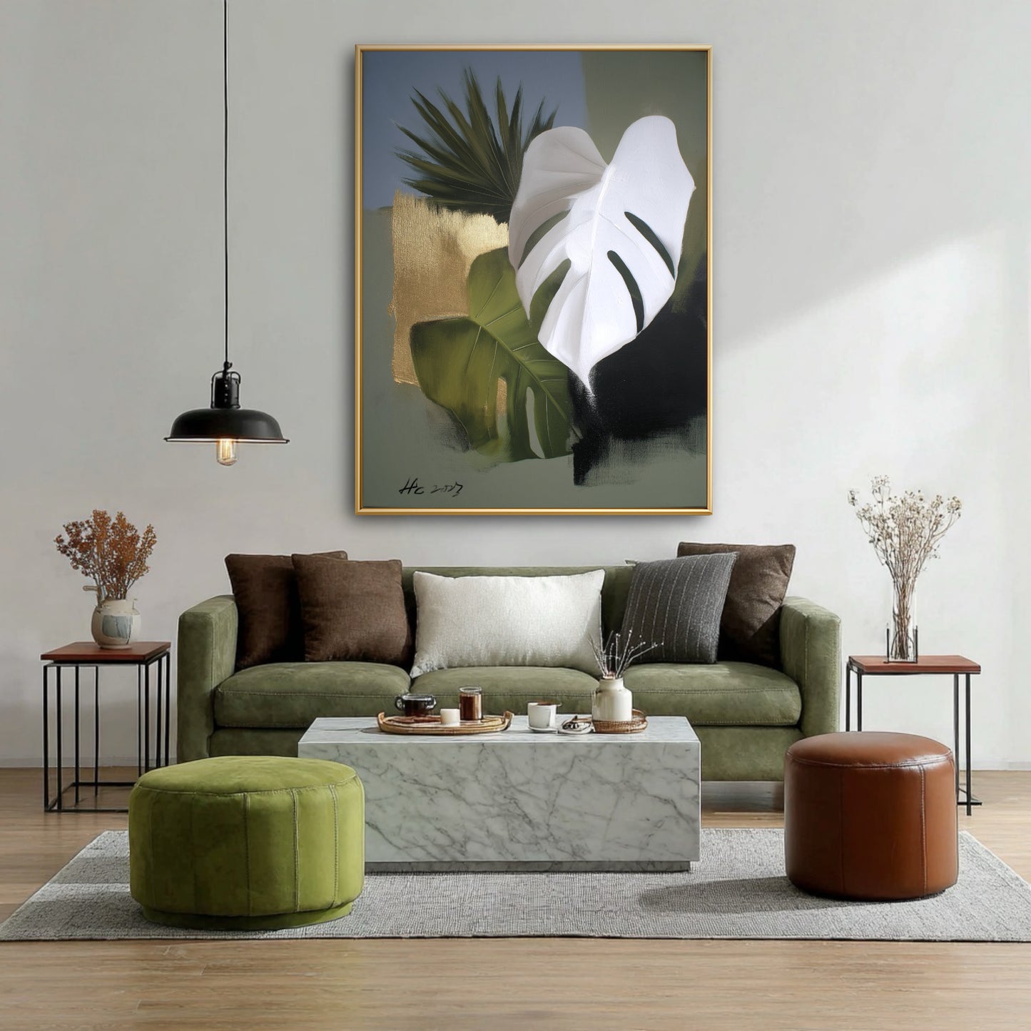 Modern living room with green sofa, marble table, and large abstract botanical wall art with gold and white leaves.