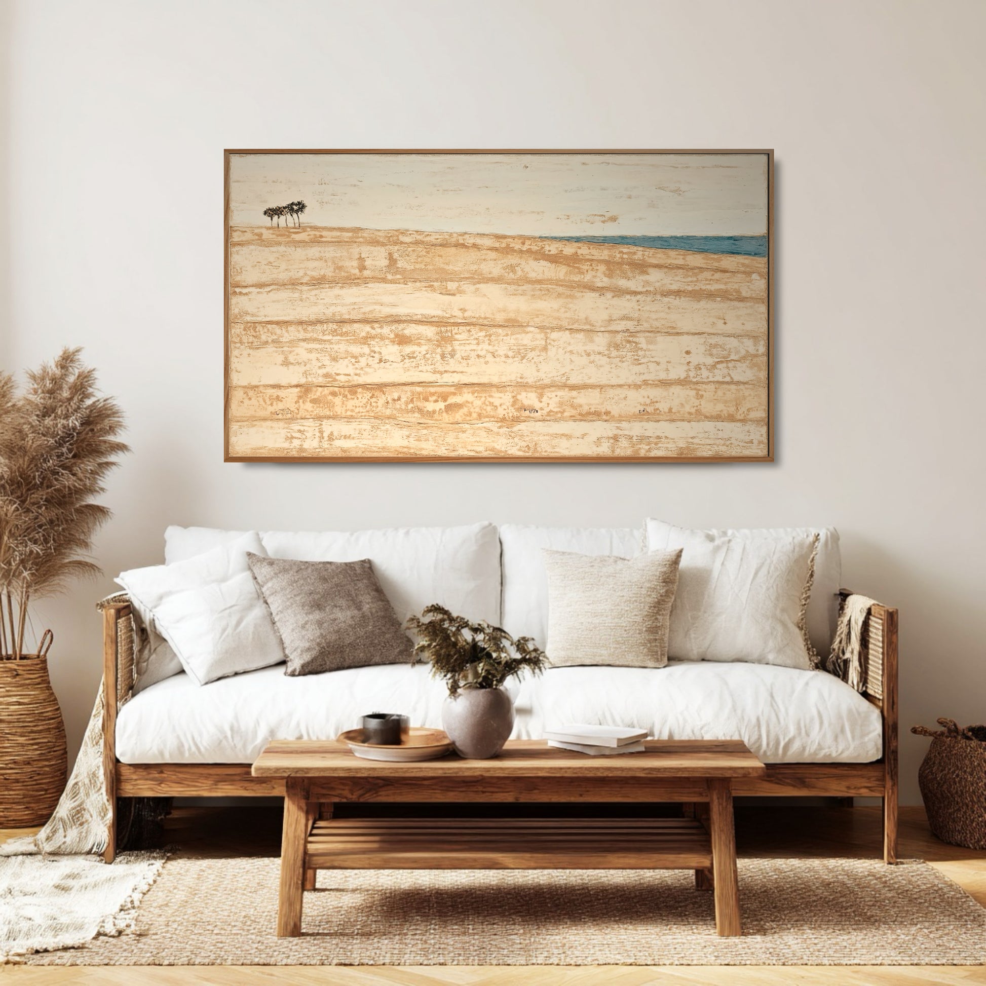 Coastal abstract original painting enhances the serene, warm atmosphere and natural rattan textures of this Bohemian living room.