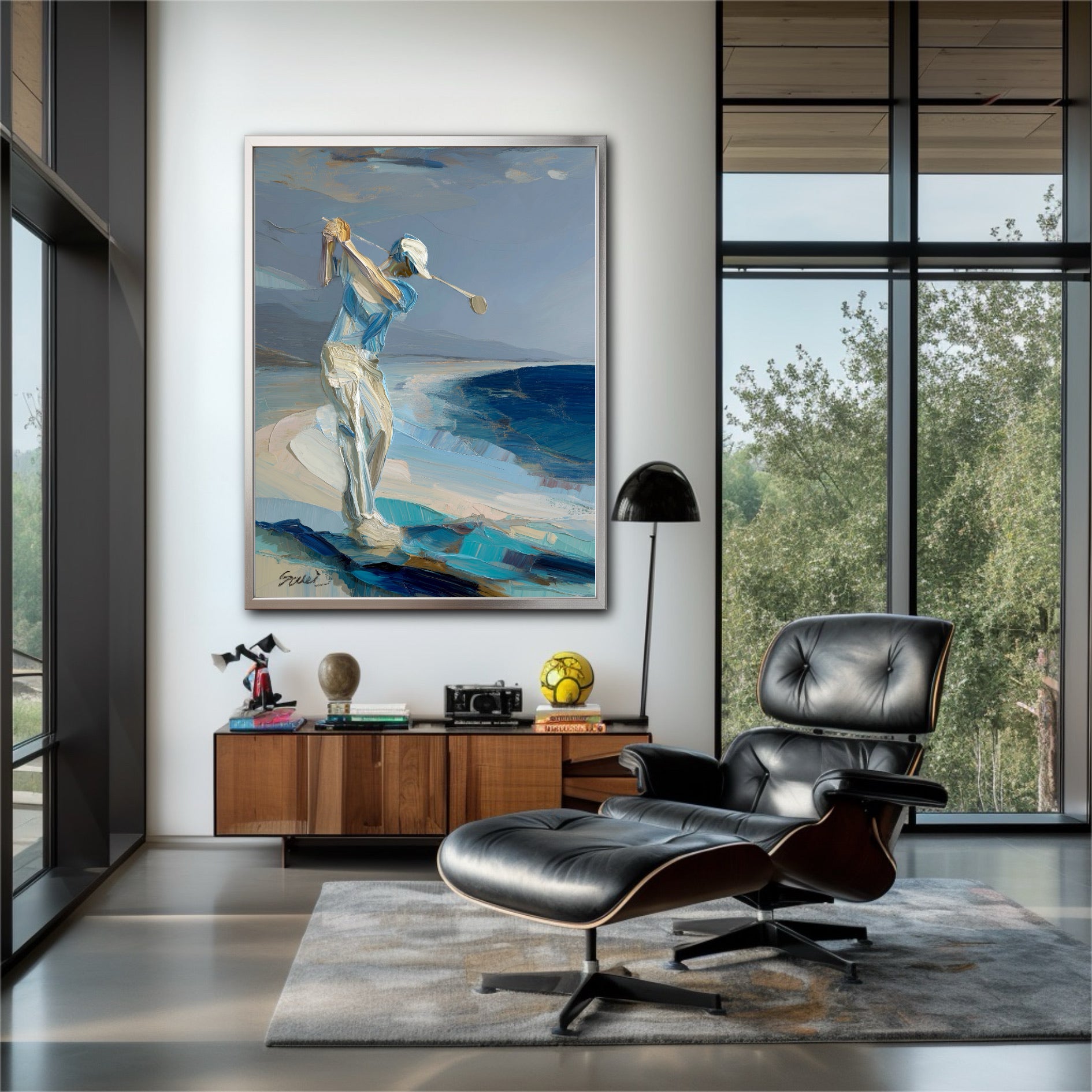 Coastal golf painting in mid-century lounge. Blue textured art complements leather chair and window view for a relaxing vibe.