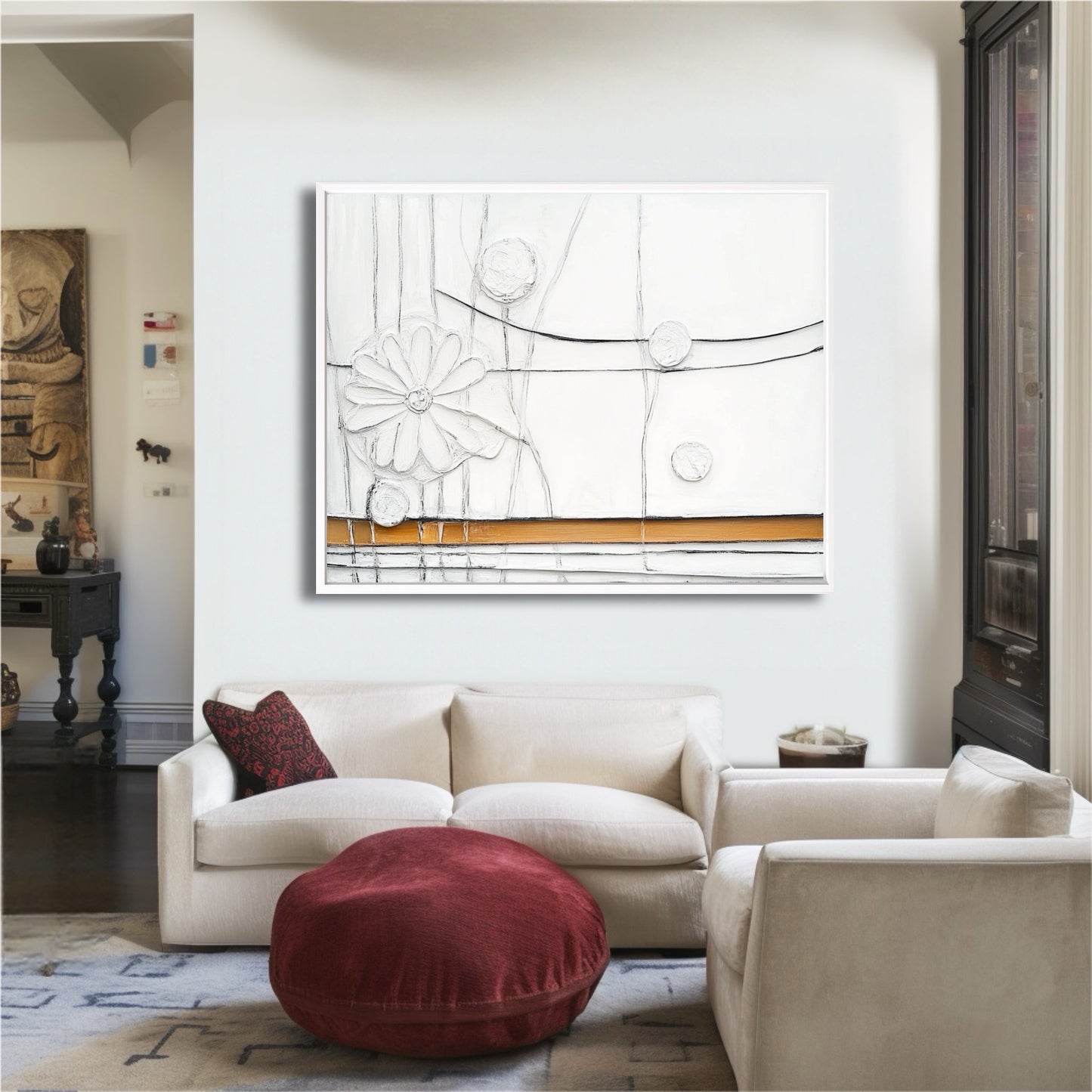 A bright abstract floral painting adds modern elegance, creating a focal point above a cream sofa in a classically styled living room.