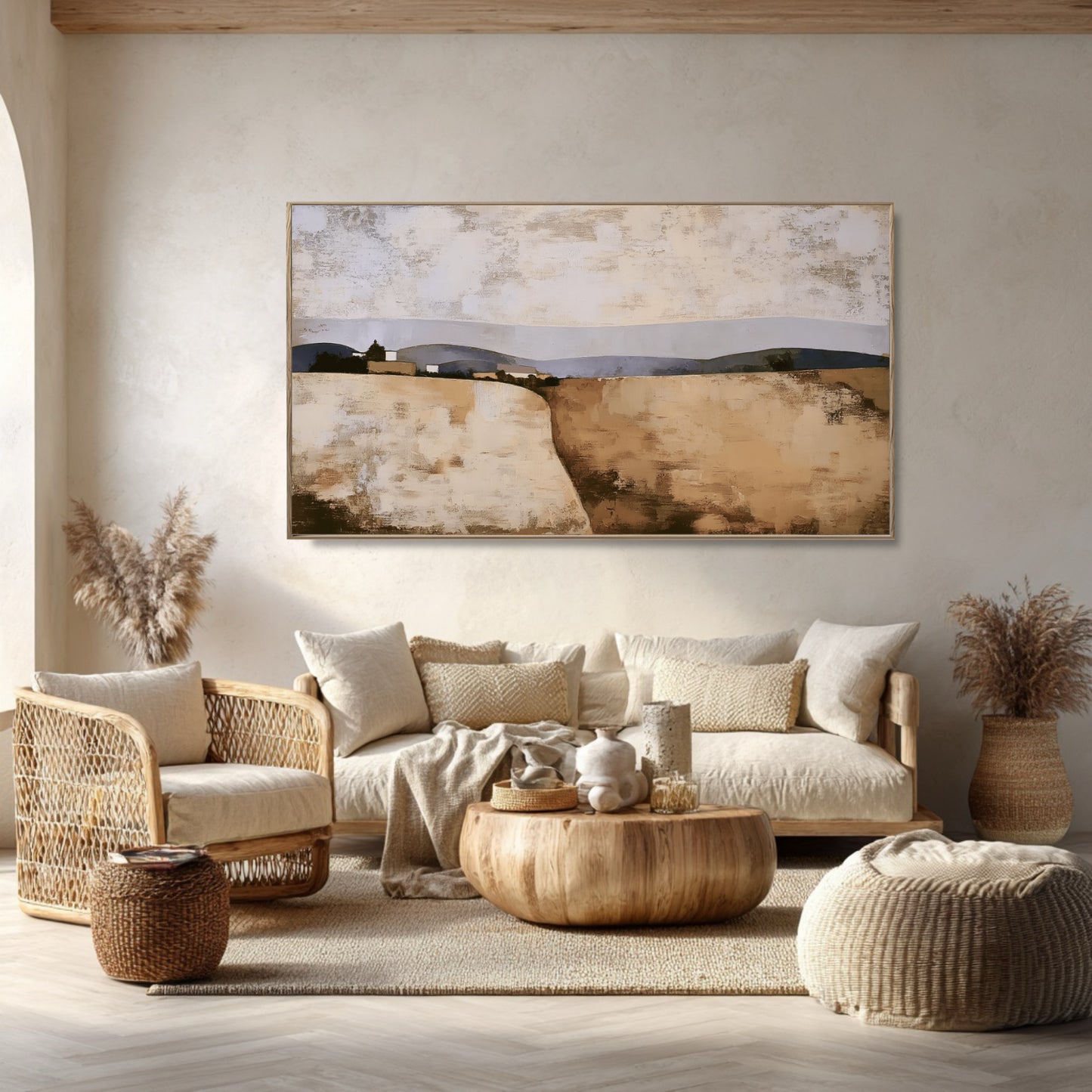 Textured original art complements a serene Bohemian living space with rattan, soft textiles, natural wood, and warm light.