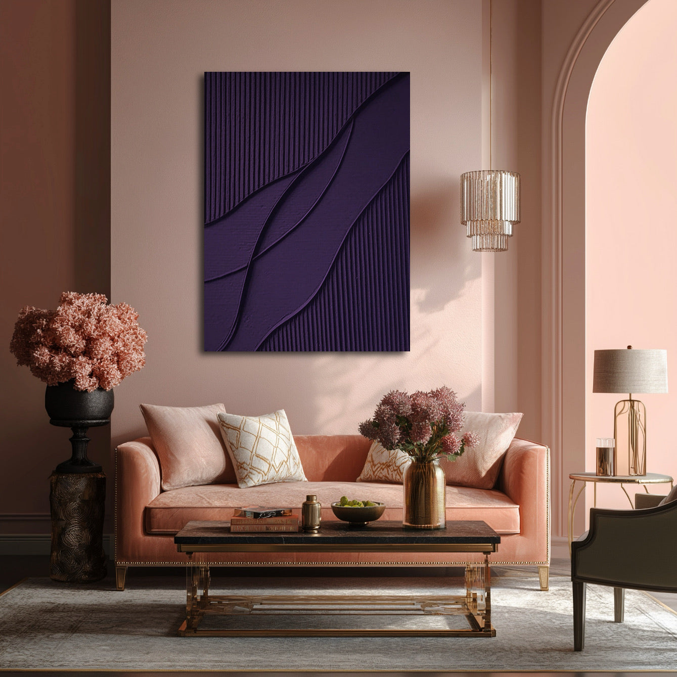 Deep purple art over pink velvet sofa, providing a cool anchor to a warm, glamorous room with gold accents and lush texture.