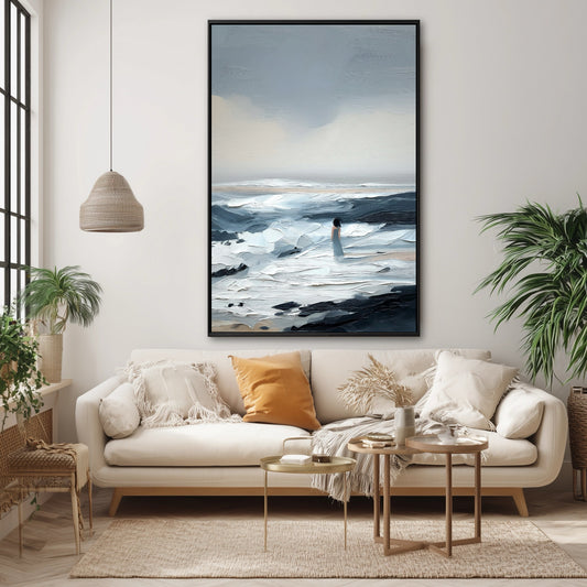 A large vertical abstract painting's cool blue tones provide a serene contrast to the warm orange pillow and boho decor.