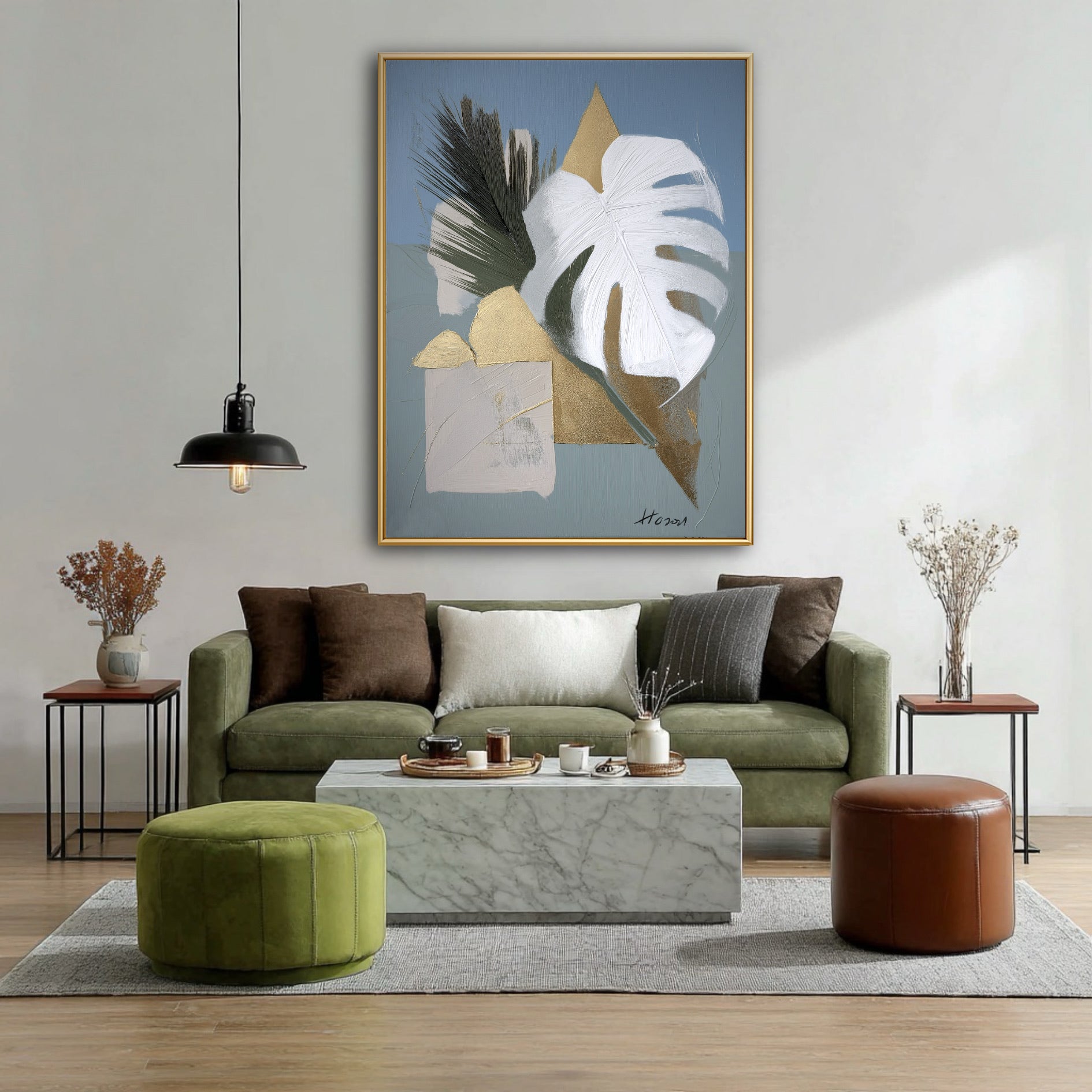 Gold and white leaf painting in a contemporary living room. Metallic accents pop against the deep green velvet sofa and marble.