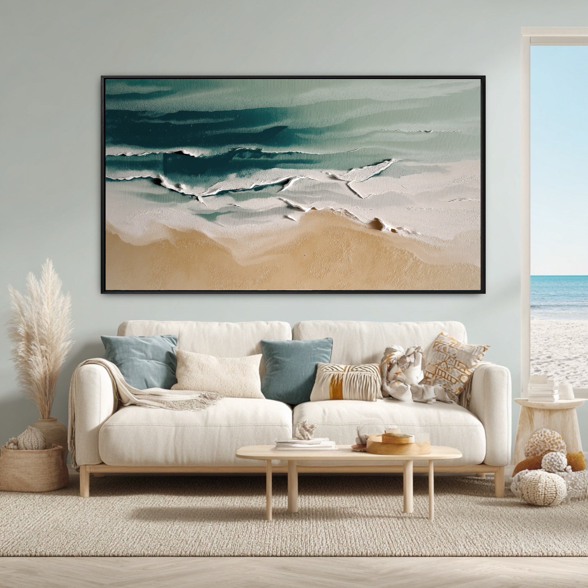 The large aerial beach painting perfectly matches the room's coastal boho decor and the actual ocean view from the window.