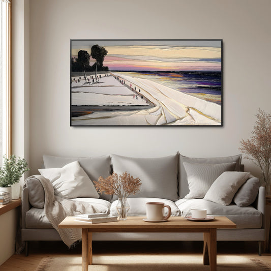 Original sunset coastal art introduces color and texture over a minimalist gray sofa and wooden coffee table; enhances the window light and cozy vibe.