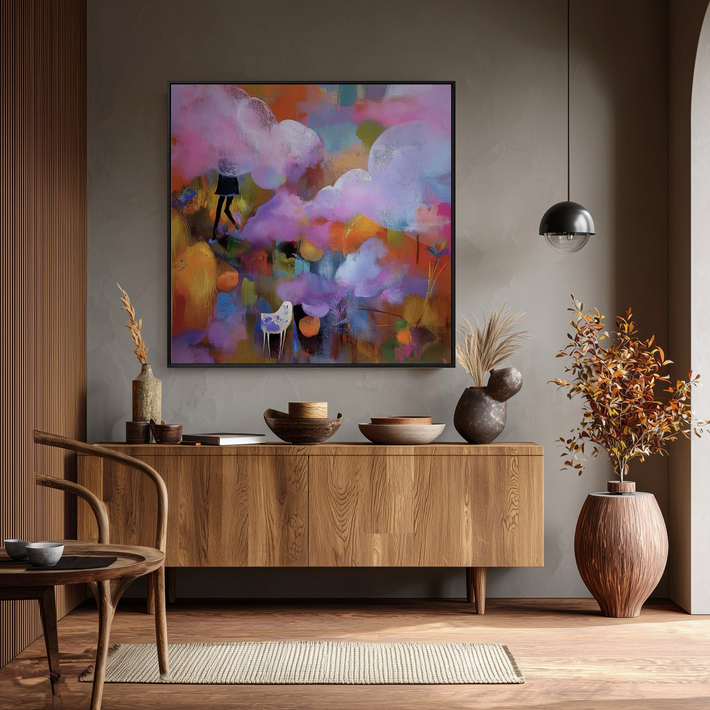 Expressive abstract painting is a focal point over a mid-century modern console; its bright colors pop against the moody gray wall and warm wood accents.