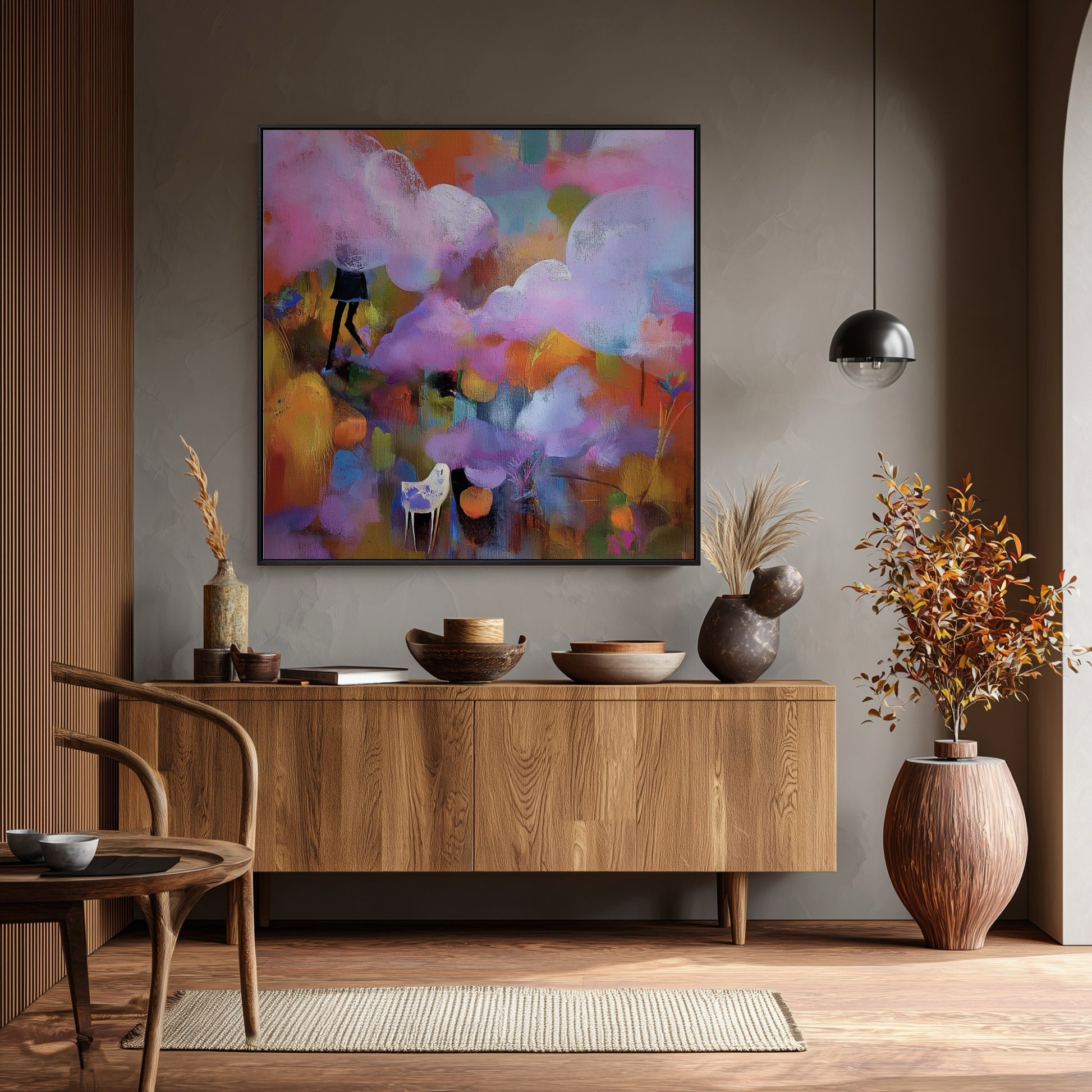 Expressive abstract painting is a focal point over a mid-century modern console; its bright colors pop against the moody gray wall and warm wood accents.