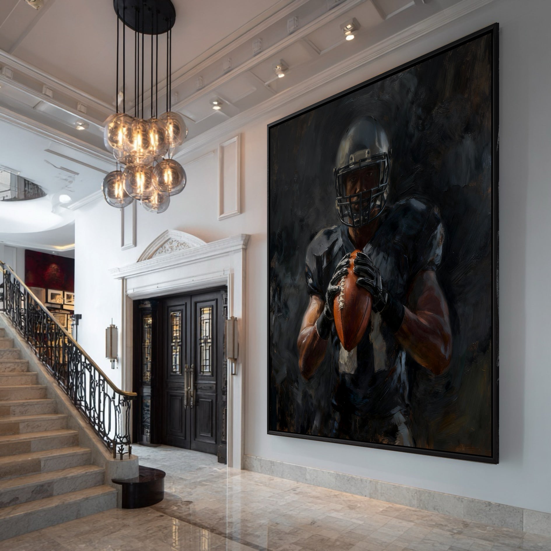 Very large framed painting of a football player hanging in the grand entryway of a luxury home with a marble staircase.