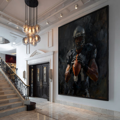 Very large framed painting of a football player hanging in the grand entryway of a luxury home with a marble staircase.