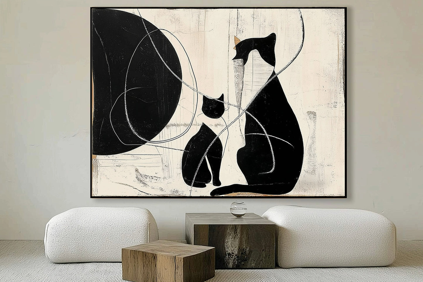 Textured cat art balances the natural wood and low-profile white furniture, adding strong black contrast to a minimalist lounge.