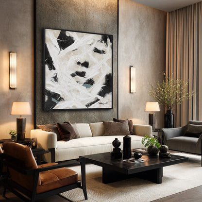 Large framed abstract painting in a sophisticated living room with dark walls, modern furniture, and warm accent lighting.