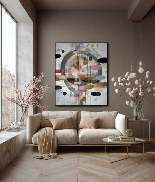 Abstract painting complementing the warm taupe walls and plush beige sofa in a cozy, inviting living space.
