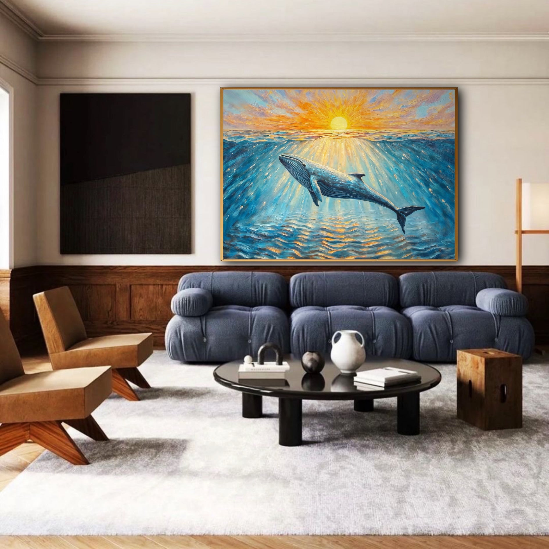 A large whale and sunset painting hangs above a plush blue sofa in a modern living room with dark wood paneling.