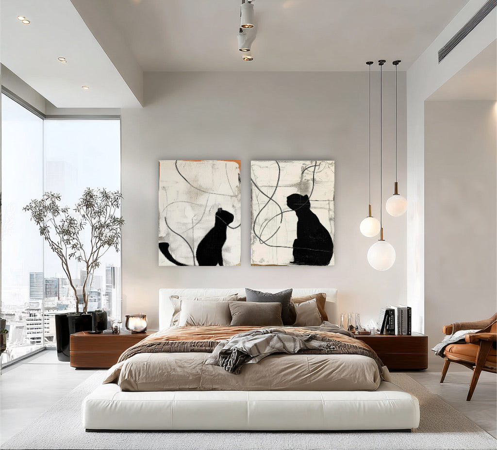 Abstract cat art diptych hangs above a low, luxurious bed, complementing the earthy tones and high-rise city view bedroom design.