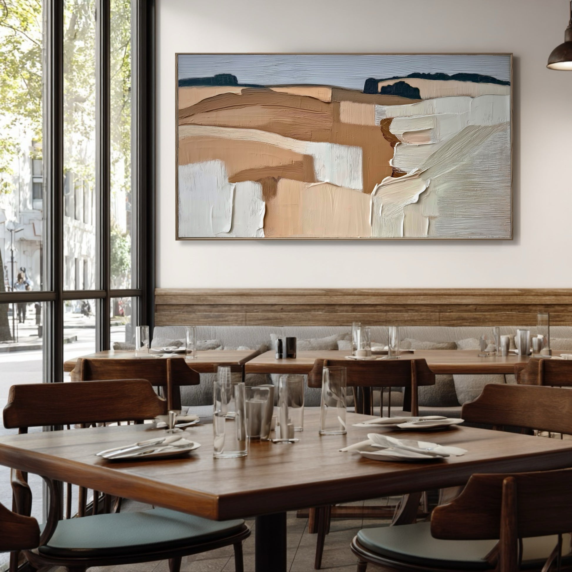 Earthy abstract landscape anchors the dining area, complementing the rich wood furniture and providing a serene counterpoint to the urban view.