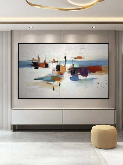 Expansive abstract painting anchoring a luxurious space above a white console, its bold colors complementing the gold ceiling trim.