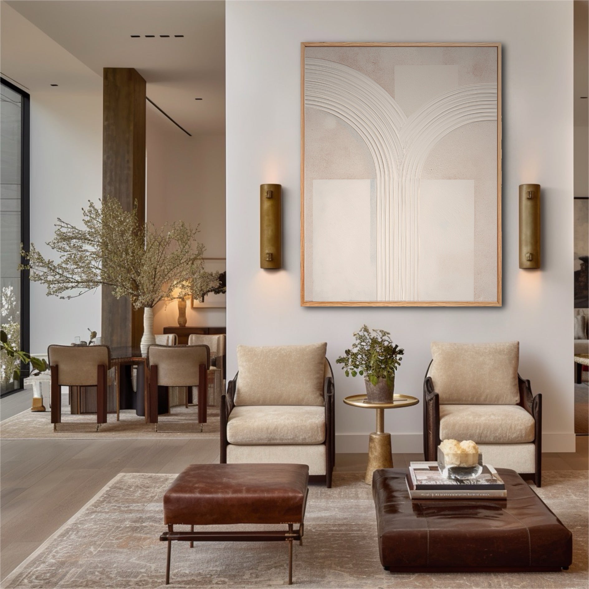 Large original plaster art with arches in an elegant living room with leather furniture and brass wall sconces.