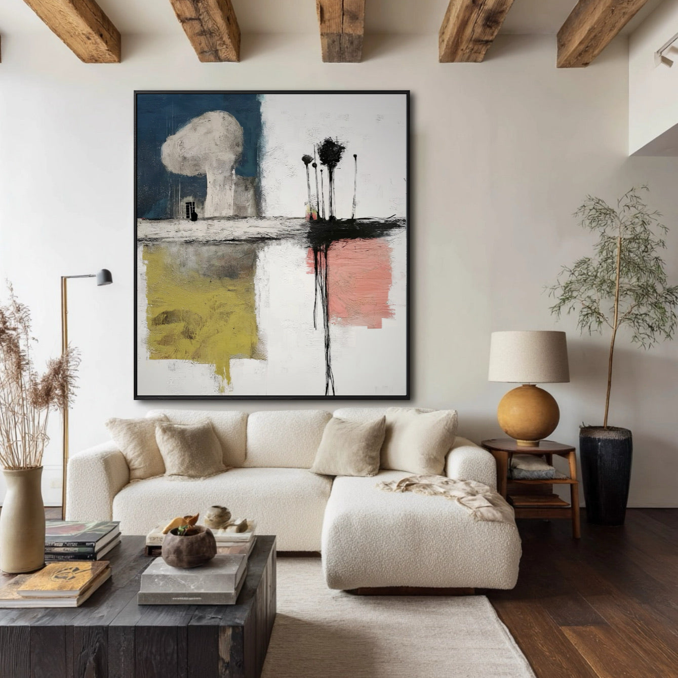 Modern living room with abstract art, white sofa, and wooden floor.