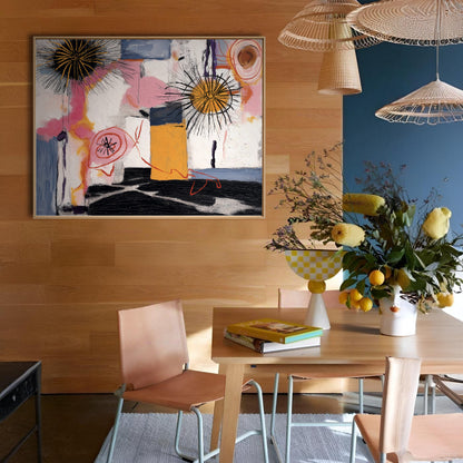 Dining room with abstract art, table, chairs, and decorative elements.