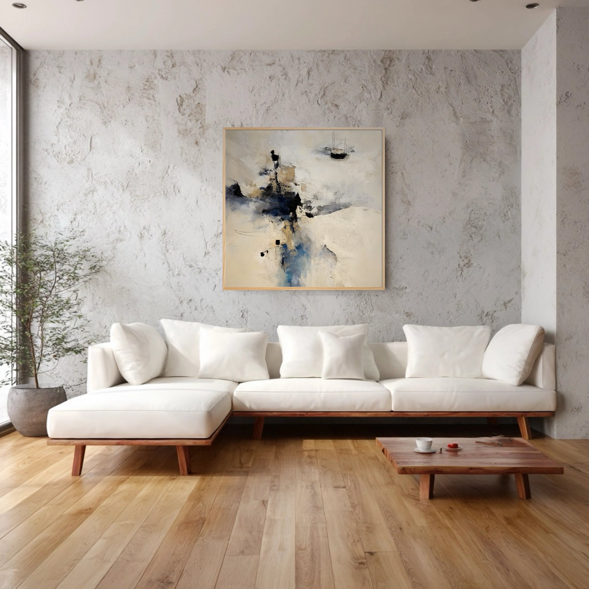 Abstract original painting complements a bright, organic modern living room; subtle textures on the wall and white sofa blend with the art's neutral tones and wood floor.